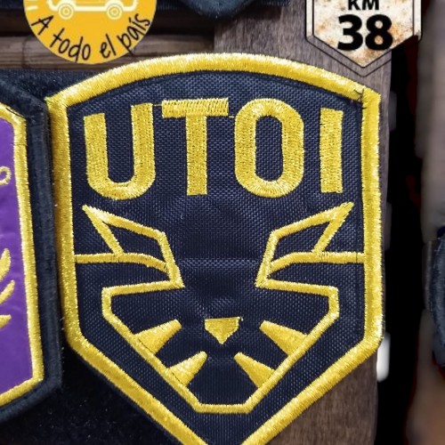 escudo UTOI oro
