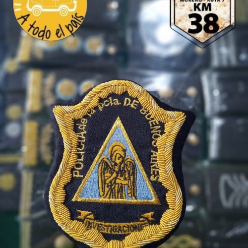 escudo bordado investigaciones